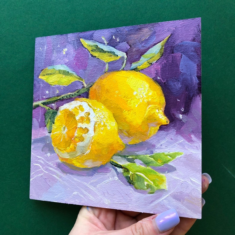 May include: Two yellow lemons with green leaves on a purple background. The lemons are painted in a realistic style with visible brushstrokes.
