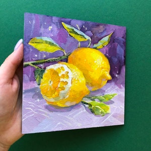 May include: Two yellow lemons with green leaves on a purple background. The lemons are painted in a realistic style with visible texture.
