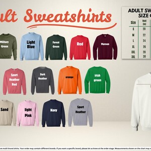 The image is an adult sweatshirt size chart, displaying various colored sweatshirts with their corresponding sizes and measurements.