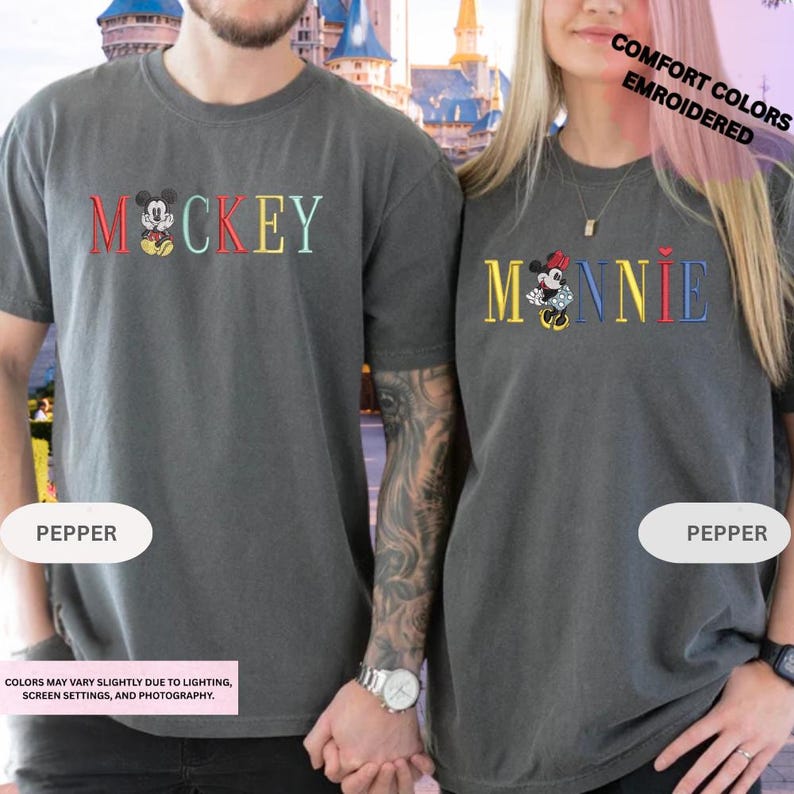 A man and a woman wearing matching t-shirts with the Disney character Mickey Mouse printed on them.