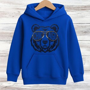 A blue hoodie with a graphic of a bear wearing sunglasses and the text "CHICAGO" printed on it.