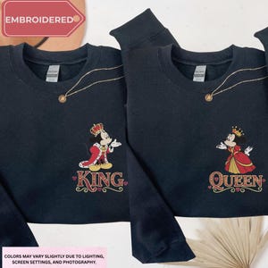 two black sweatshirts with the Disney characters Mickey Mouse and Minnie Mouse, each with a crown and the text "King" and "Queen" printed on them.