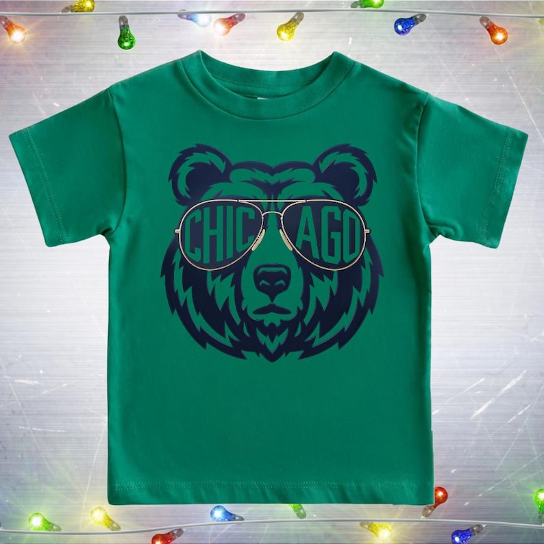 A green t-shirt with a graphic of a bear wearing sunglasses and the word "CHICAGO" printed on it.