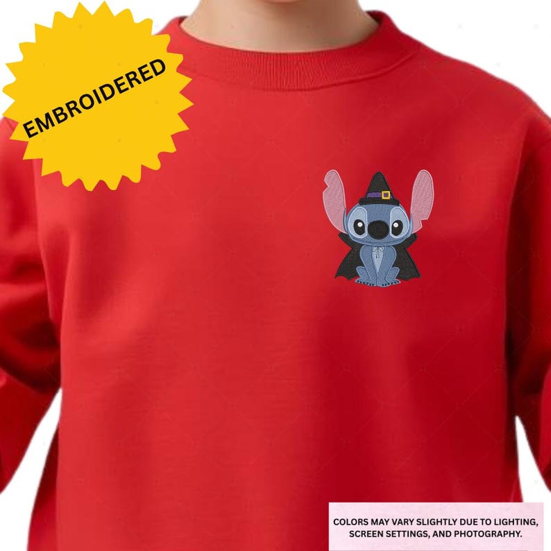 Embroidered image of a character wearing a witch's hat on a red shirt.