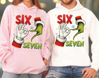 Santa and Grnch 6 7 Hands Meme T-Shirt, Funny Viral TikTok Six Seven Christmas Sweatshirt, Christmas Social Media Trend Hoodie
