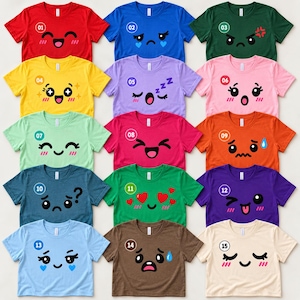 May include: A collection of fifteen short-sleeved t-shirts in various colors, each featuring a unique printed emoji face. The shirts are arranged in a grid, displaying expressions ranging from happy and sleepy to surprised and sad, with numbered circles.