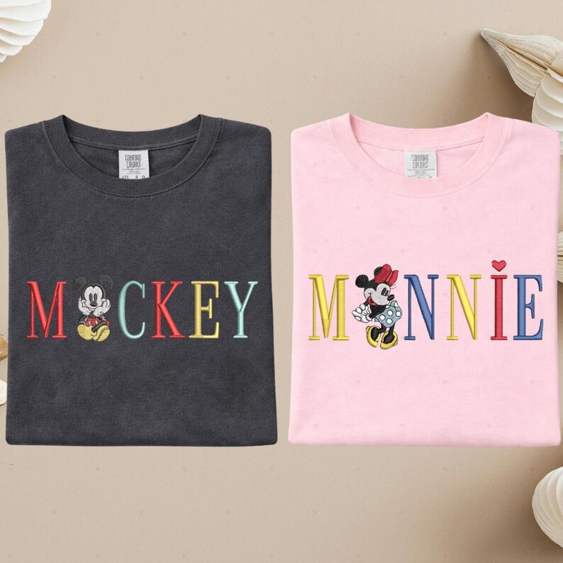 two t-shirts with the word "MICKEY" and the character Minnie Mouse printed on them.