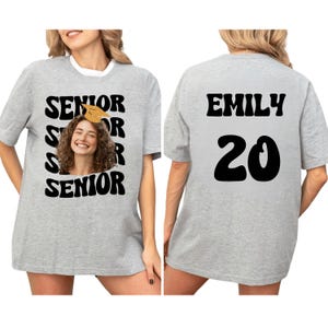 a woman wearing a t - shirt that says senior senior senior senior senior senior senior