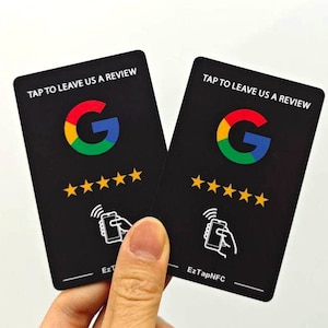 May include: Two black cards with the Google logo and the text "TAP TO LEAVE US A REVIEW". The cards have five stars and a symbol of a phone with a hand tapping it. The text "EzTapNFC" is on the bottom of the card.