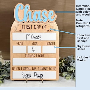 May include: Wooden first day of school sign with the name "Chase" in blue. Includes a dry erase board for grade, age, and aspirations. Features an interchangeable name plaque and banner.