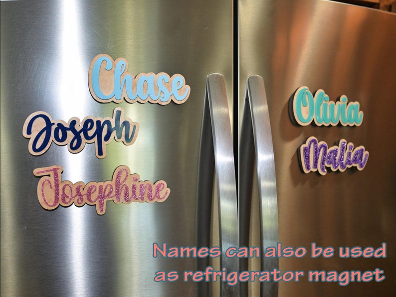 May include: Wooden name magnets in various colors, including blue, teal, and pink glitter, are displayed on a stainless steel refrigerator. The names "Chase", "Joseph", "Josephine", "Olivia", and "Malia" are visible. Text at the bottom reads "Names can also be used as refrigerator magnet".