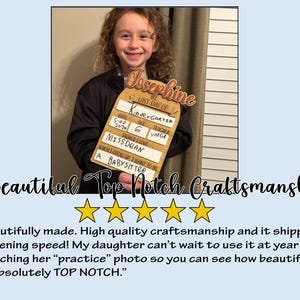 May include: A wooden sign with the name "Josephine" at the top. The sign has sections for "Last Day of Kindergarten", date, age, teacher, and things I love. The text "When I grow up, I want to be a babysitter" is also included.