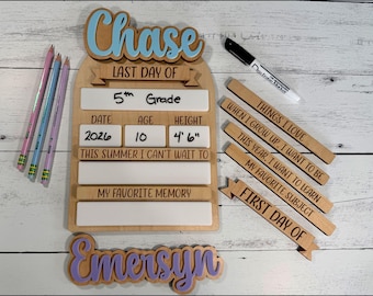 May include: A wooden sign with the name "Chase" in blue, and the words "LAST DAY OF" above a section for "5th Grade." Includes sections for date, age, and height (4'6"). Also includes wooden tags with phrases like "Things I Love."