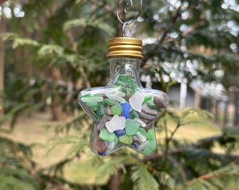 Adorno de estrella relleno de vidrio marino