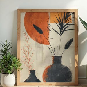 Puede incluir: Impresión artística abstracta en un marco de madera. La obra presenta un diseño minimalista con un gran círculo naranja, jarrones negros y elementos botánicos. La paleta de colores incluye naranja, negro y beige.