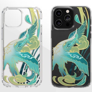May include: A clear phone case featuring a design of two teal blue birds with gold accents on a white background. The case has a cutout for the camera lens.