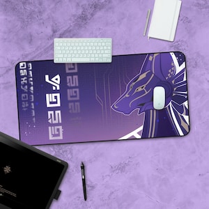 May include: Purple and white gaming mouse mat featuring a stylised Anubis design and the text "EGGS EGGS EGGS" in a futuristic font.