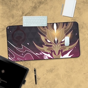May include: A black and purple gaming mouse pad with a gold dragon design. The dragon has a fierce expression and glowing eyes. The mouse pad is decorated with a geometric pattern and a white mouse is on the surface.