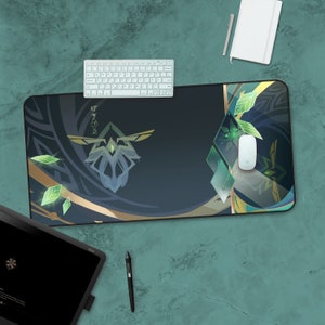 May include: A black and green gaming mouse mat with a geometric design and a stylised green leaf pattern. The mouse mat features a white mouse and a white keyboard.