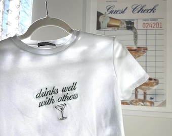 Drinks Well With Others Women’s Baby Tee| St Patrick’s Day| St Paddy’s Shirt