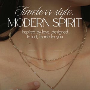 May include: A gold-toned layered necklace with a circular pendant. The image includes the text "Timeless style, MODERN SPIRIT" and "Inspired by love, designed to last, made for you."