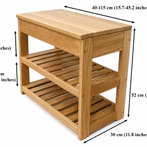 May include: A light brown wooden console table with a solid top and two slatted shelves. Dimensions are 40-115 inches wide, 30 inches deep, and 52 inches high. The upper section is 16 inches high, with a 17-inch gap between the two lower shelves.