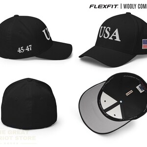 May include: A black Flexfit wooly combed cap featuring the text USA embroidered on the front, the numbers 45-47 on the side, and a small American flag patch on the other side. The cap has a structured crown, a curved brim, and a light grey interior.