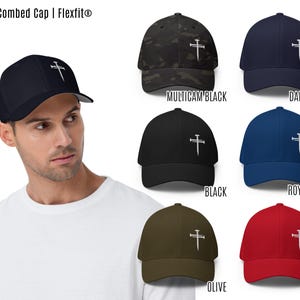 This Flexfit cap, adorned with an embroidered three nails cross, is a refined nail cross hat that doubles as a cross baseball cap and religious baseball hat. A perfect three nails hat for Christian hats, it is also identified as a cross hat, cross hats men, 3 nails flexfit hat, Christian cross cap, nail and cross hat, baseball hat embroidered cross, black hat with cross, mens fitted christian hat, rusty nails cross cap, three nail flex fit hat, 3 cross hat, and three nails hats.