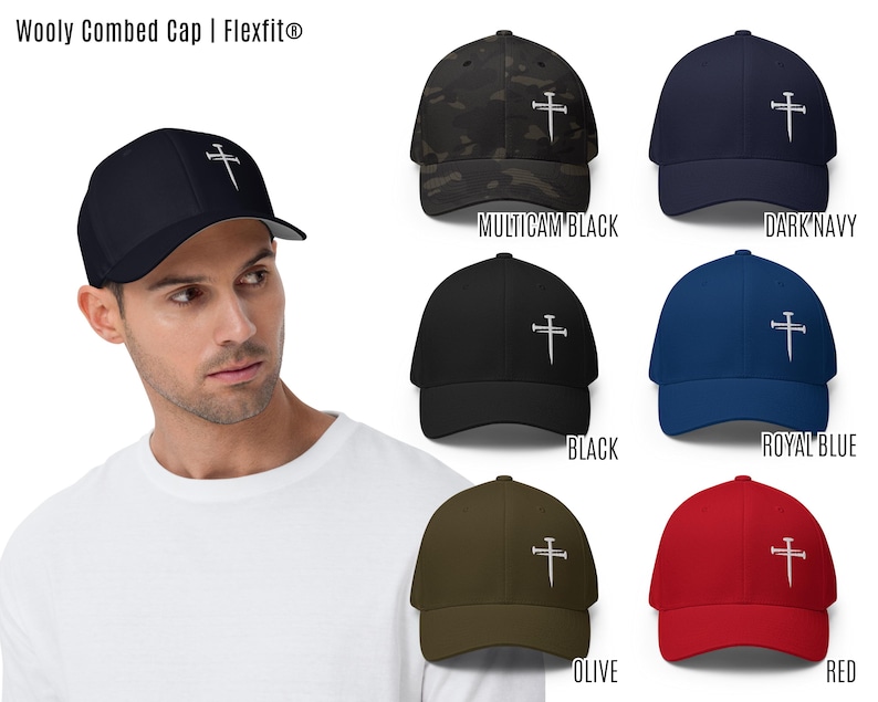 This Flexfit cap, adorned with an embroidered three nails cross, is a refined nail cross hat that doubles as a cross baseball cap and religious baseball hat. A perfect three nails hat for Christian hats, it is also identified as a cross hat, cross hats men, 3 nails flexfit hat, Christian cross cap, nail and cross hat, baseball hat embroidered cross, black hat with cross, mens fitted christian hat, rusty nails cross cap, three nail flex fit hat, 3 cross hat, and three nails hats.