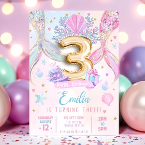May include: A birthday invitation featuring a mermaid theme. The design includes a gold number 3 balloon, mermaid tails, and the text "Emilia is turning three!" The invitation is decorated with pastel colors and party details.