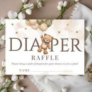 May include: A baby shower invitation with the words "DIAPER RAFFLE" in brown letters. A teddy bear illustration holds balloons. The invitation includes space for a name and the text "Please bring a pack of diapers for your chance to win a prize!"