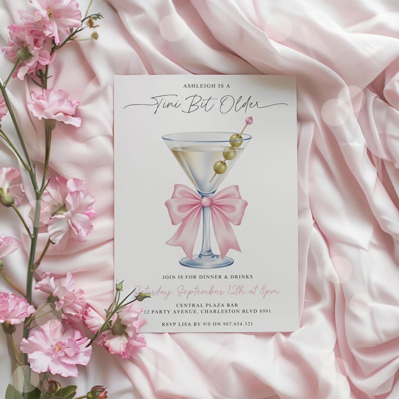 May include: A party invitation with a martini glass illustration and a pink bow. The text reads "Ashleigh is a Tini Bit Older" and includes event details: dinner and drinks, date, time, location, and RSVP information.