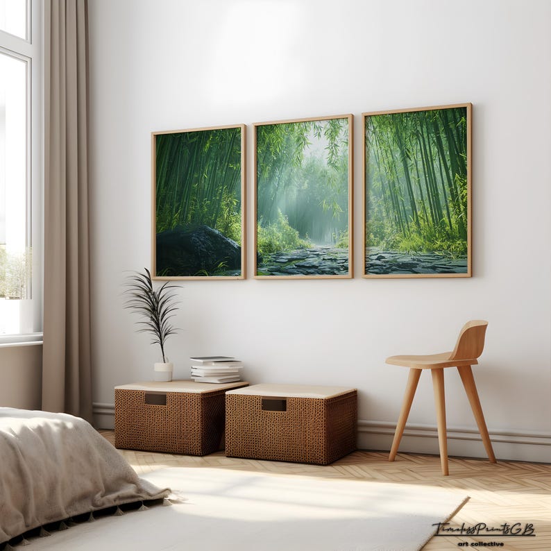 May include: Three framed prints of a lush green bamboo forest with a stone path leading through the center. The prints are hung on a white wall in a modern living room setting.