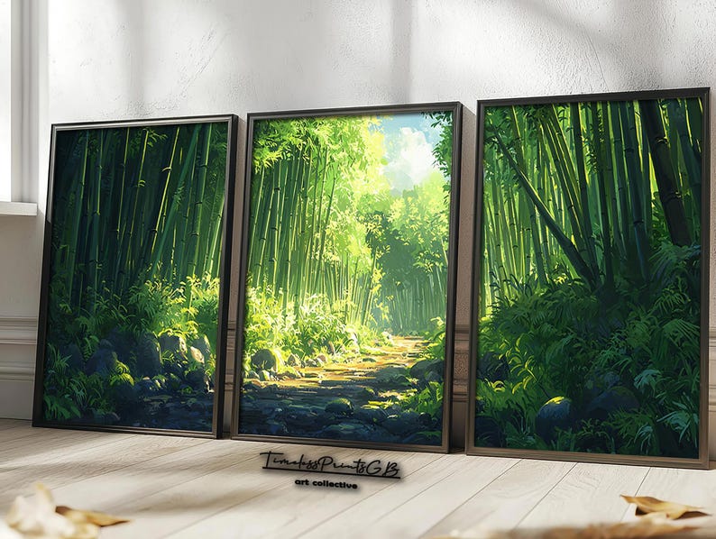 May include: Three framed art prints depicting a bamboo forest scene. The artwork features lush green bamboo stalks, a stone path, and sunlight filtering through the trees. The frames are dark brown.