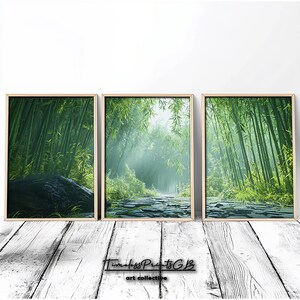 May include: A set of three framed prints featuring a misty green bamboo forest path. The prints are in wooden frames and are arranged in a row.