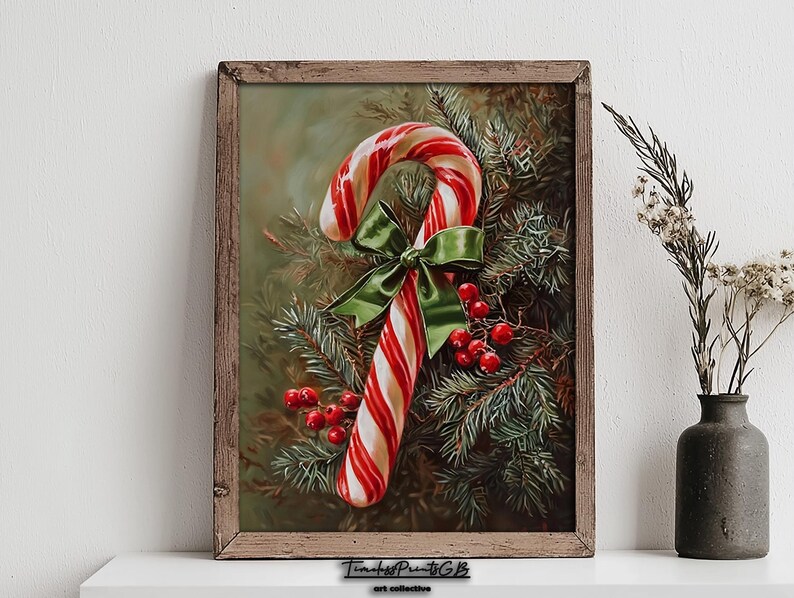 May include: A framed print of a candy cane with red and white stripes, decorated with a green bow and red berries, set against evergreen branches. The artwork is in a rustic wooden frame.