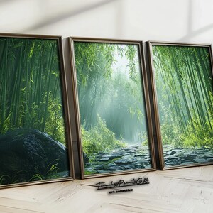 May include: Three framed prints of a lush green bamboo forest with sunlight streaming through the leaves. The prints are in brown frames and are arranged in a row on a wooden floor.