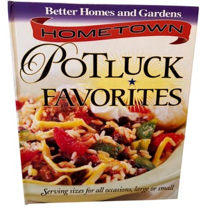 May include: A cookbook titled "Hometown Potluck Favorites" by Better Homes and Gardens. The cover features a colorful dish of rice, black beans, vegetables, and meat. The text "Serving sizes for all occasions, large or small" is at the bottom of the cover.