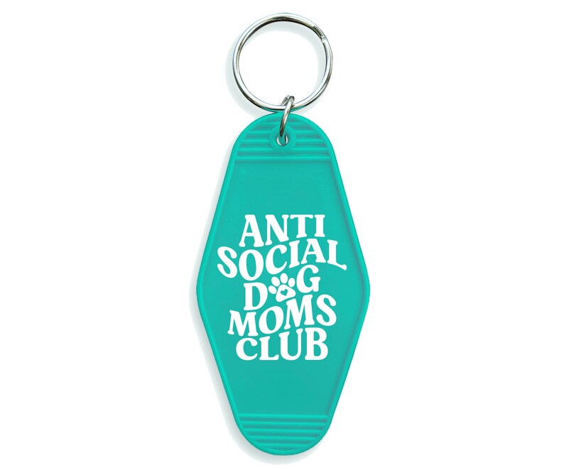 May include: Teal blue motel key chain with the text "Anti Social Dog Moms Club" in white.