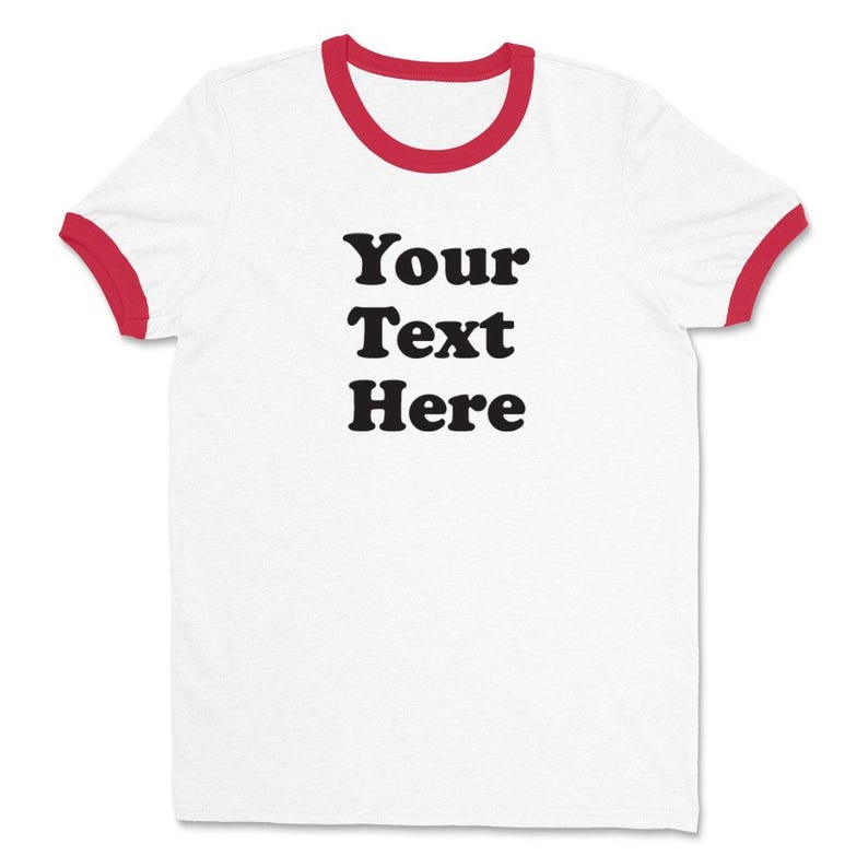 May include: White t-shirt with red ringer sleeves and the text "Your Text Here" printed in black.