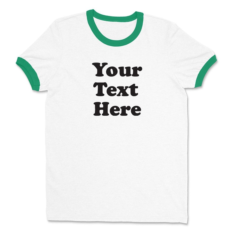 May include: White t-shirt with a green ringer and the text "Your Text Here" printed in black.