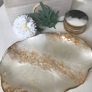 May include: White resin serving tray with a gold leaf design and a wavy edge.