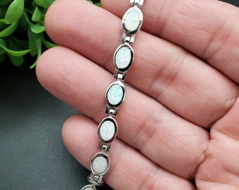 ナバホ族のハンドメイド レッド ファイア オパール インレイ オニキス