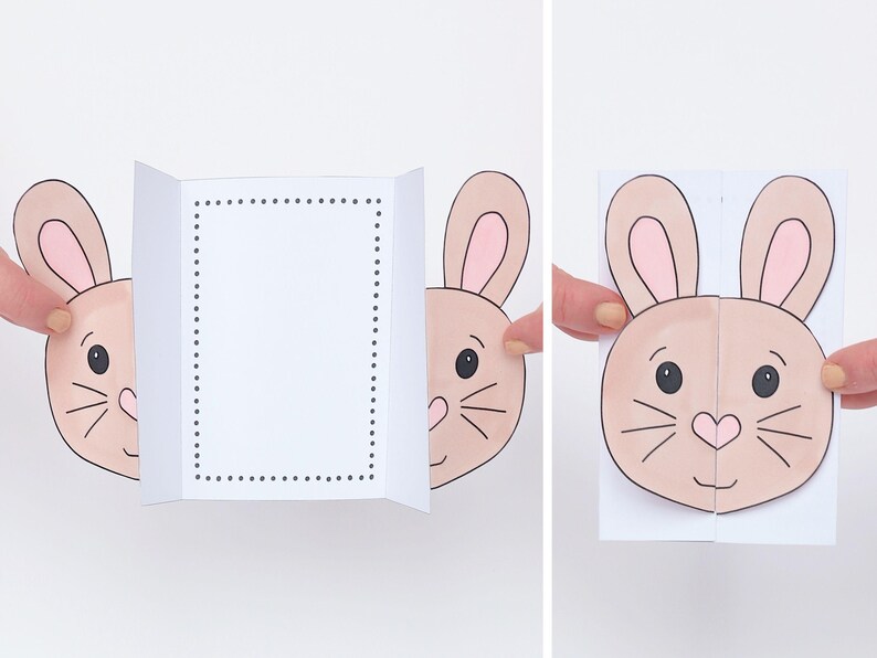 K&ouml;nnte beinhalten: Eine Pop-up-Karte mit einem Hasengesicht. Die Karte ist in der Mitte gefaltet und das Hasengesicht springt heraus, wenn die Karte ge&ouml;ffnet wird. Der Hase hat rosa Ohren, braunes Fell und schwarze Augen.