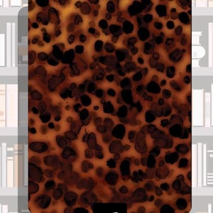 May include: A rectangular object with a tortoiseshell pattern of dark brown and black spots on a light brown background. The object has rounded corners and a black box in the lower centre with the number "#1" in white.