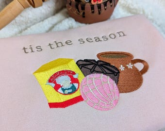 Sudadera navideña bordada con cuello redondo y concha de chocolate caliente mexicano