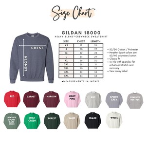May include: A size chart for a Gildan 18000 heavy blend crewneck sweatshirt. The chart shows chest and length measurements in inches for sizes XS to 5XL. Various sweatshirt colors are displayed, including red, black, and white.