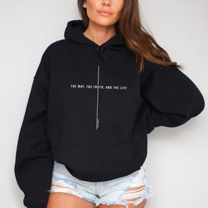 May include: Black hooded sweatshirt with the text "THE WAY, THE TRUTH, AND THE LIFE" and "JOHN 14:6" printed in white.