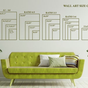 May include: A wall art size guide with different ratios and dimensions in inches. The guide shows the sizes of art prints in a variety of ratios, including 4:5, 2:3, and 3:4. The guide is displayed on a white wall with a green sofa and a plant in the foreground.