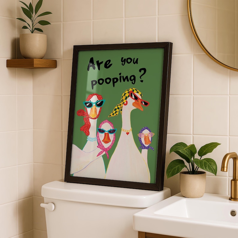 Illustrated geese standing in a row on a light green background, wearing headscarves and sunglasses, with the handwritten phrase “Are you pooping?” above them in playful lettering.